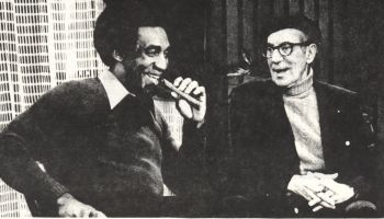 Bill Cosby emulates Groucho's cigar smoking.