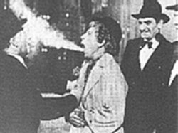 Melville Cooper, Harpo, and Bruce Gordon in a scene from the film