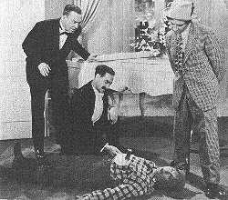 Donald MacBride, Groucho, Harpo, and Chico in a scene from the film.