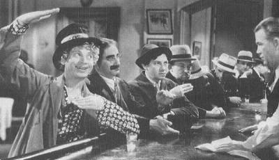 Harpo, Groucho, and Chico decide on a little libation before getting down to business.